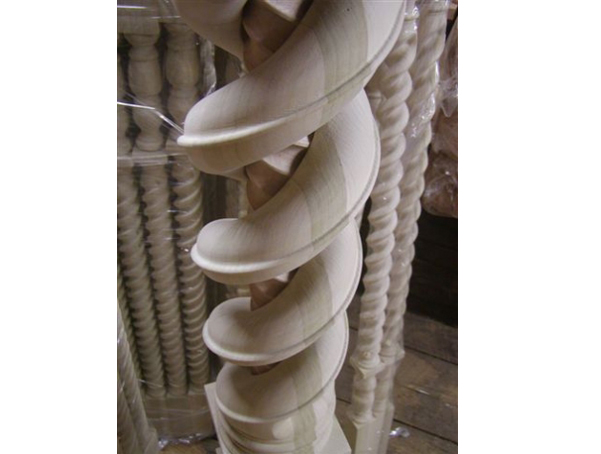 Wooden Newel post that is constructed so that a larger twist is over a smaller twist.
